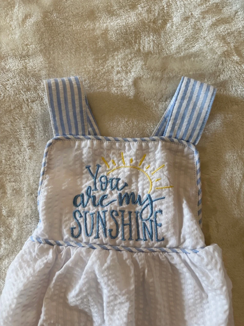 White Seersucker Baby Bib Romper with Blue Embroidered Sunshine